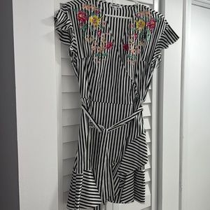 gray striped with white embroidery of red flowers